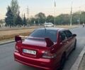 Красный Мицубиси Лансер, объемом двигателя 2 л и пробегом 307 тыс. км за 4500 $, фото 5 на Automoto.ua