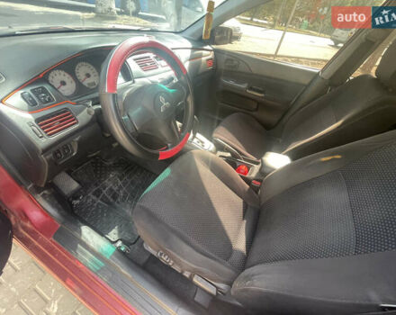 Червоний Міцубісі Lancer, об'ємом двигуна 1.58 л та пробігом 290 тис. км за 4250 $, фото 11 на Automoto.ua