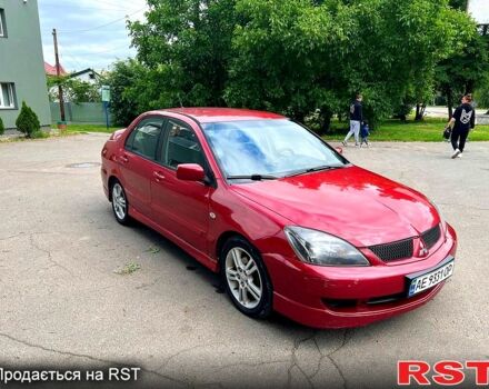 Красный Мицубиси Лансер, объемом двигателя 2 л и пробегом 223 тыс. км за 2900 $, фото 1 на Automoto.ua
