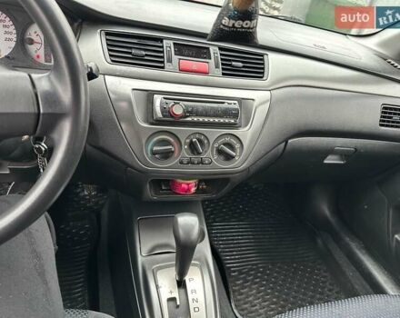 Красный Мицубиси Лансер, объемом двигателя 1.6 л и пробегом 185 тыс. км за 5000 $, фото 15 на Automoto.ua