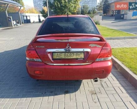 Красный Мицубиси Лансер, объемом двигателя 1.6 л и пробегом 73 тыс. км за 5500 $, фото 5 на Automoto.ua