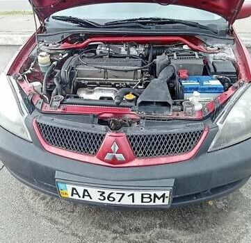 Красный Мицубиси Лансер, объемом двигателя 2 л и пробегом 320 тыс. км за 4600 $, фото 4 на Automoto.ua
