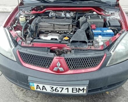 Красный Мицубиси Лансер, объемом двигателя 2 л и пробегом 320 тыс. км за 4600 $, фото 5 на Automoto.ua