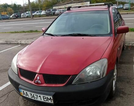 Красный Мицубиси Лансер, объемом двигателя 2 л и пробегом 320 тыс. км за 4600 $, фото 2 на Automoto.ua