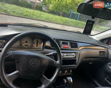 Красный Мицубиси Лансер, объемом двигателя 1.6 л и пробегом 312 тыс. км за 4600 $, фото 8 на Automoto.ua