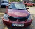 Червоний Міцубісі Lancer, об'ємом двигуна 1.6 л та пробігом 250 тис. км за 3650 $, фото 1 на Automoto.ua