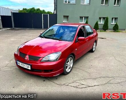 Красный Мицубиси Лансер, объемом двигателя 2 л и пробегом 223 тыс. км за 2900 $, фото 2 на Automoto.ua