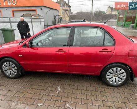 Красный Мицубиси Лансер, объемом двигателя 1.6 л и пробегом 185 тыс. км за 5000 $, фото 1 на Automoto.ua