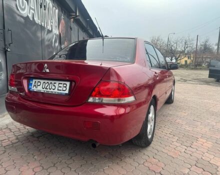 Красный Мицубиси Лансер, объемом двигателя 1.6 л и пробегом 276 тыс. км за 4350 $, фото 4 на Automoto.ua