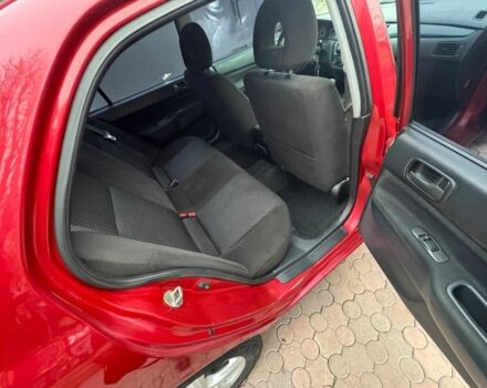 Красный Мицубиси Лансер, объемом двигателя 1.6 л и пробегом 276 тыс. км за 4350 $, фото 11 на Automoto.ua