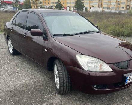 Червоний Міцубісі Lancer, об'ємом двигуна 2 л та пробігом 295 тис. км за 4150 $, фото 3 на Automoto.ua
