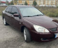 Червоний Міцубісі Lancer, об'ємом двигуна 2 л та пробігом 295 тис. км за 4150 $, фото 3 на Automoto.ua