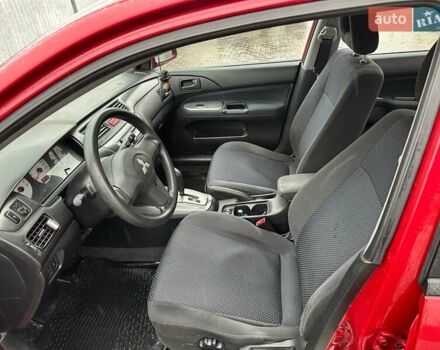 Красный Мицубиси Лансер, объемом двигателя 1.6 л и пробегом 185 тыс. км за 5000 $, фото 13 на Automoto.ua