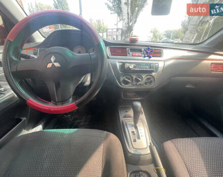 Червоний Міцубісі Lancer, об'ємом двигуна 1.58 л та пробігом 290 тис. км за 4250 $, фото 16 на Automoto.ua