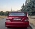 Красный Мицубиси Лансер, объемом двигателя 2 л и пробегом 307 тыс. км за 4500 $, фото 7 на Automoto.ua