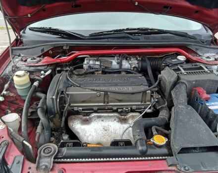 Красный Мицубиси Лансер, объемом двигателя 2 л и пробегом 320 тыс. км за 4600 $, фото 4 на Automoto.ua