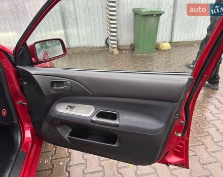 Красный Мицубиси Лансер, объемом двигателя 1.6 л и пробегом 185 тыс. км за 5000 $, фото 7 на Automoto.ua