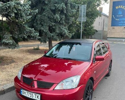 Красный Мицубиси Лансер, объемом двигателя 2 л и пробегом 307 тыс. км за 4500 $, фото 12 на Automoto.ua