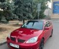Красный Мицубиси Лансер, объемом двигателя 2 л и пробегом 307 тыс. км за 4500 $, фото 12 на Automoto.ua