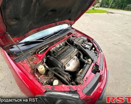 Красный Мицубиси Лансер, объемом двигателя 2 л и пробегом 223 тыс. км за 2900 $, фото 6 на Automoto.ua