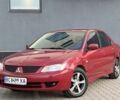 Червоний Міцубісі Lancer, об'ємом двигуна 1.6 л та пробігом 212 тис. км за 4300 $, фото 1 на Automoto.ua