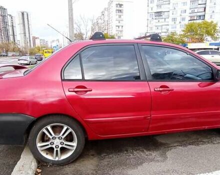Красный Мицубиси Лансер, объемом двигателя 2 л и пробегом 320 тыс. км за 4600 $, фото 3 на Automoto.ua
