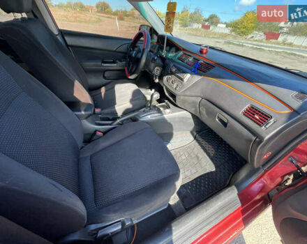 Червоний Міцубісі Lancer, об'ємом двигуна 1.58 л та пробігом 290 тис. км за 4350 $, фото 13 на Automoto.ua