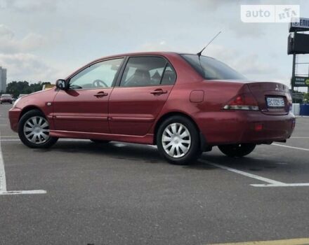 Червоний Міцубісі Lancer, об'ємом двигуна 1.6 л та пробігом 290 тис. км за 4300 $, фото 2 на Automoto.ua