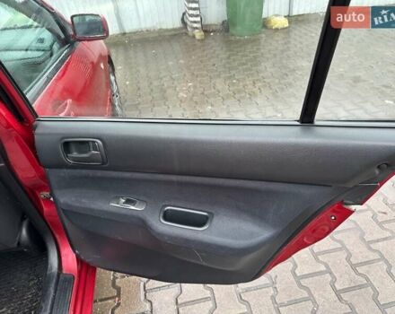 Красный Мицубиси Лансер, объемом двигателя 1.6 л и пробегом 185 тыс. км за 5000 $, фото 8 на Automoto.ua