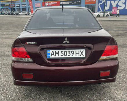 Червоний Міцубісі Lancer, об'ємом двигуна 2 л та пробігом 295 тис. км за 4150 $, фото 5 на Automoto.ua
