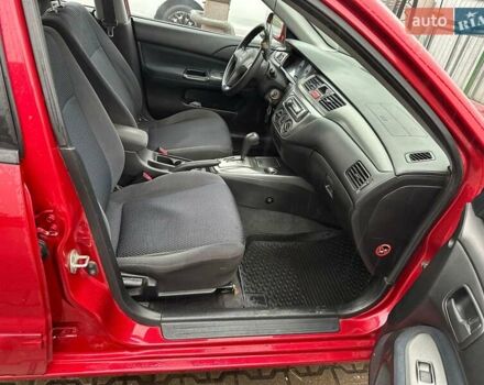 Красный Мицубиси Лансер, объемом двигателя 1.6 л и пробегом 185 тыс. км за 5000 $, фото 6 на Automoto.ua