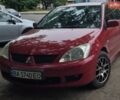 Красный Мицубиси Лансер, объемом двигателя 1.58 л и пробегом 254 тыс. км за 4200 $, фото 1 на Automoto.ua