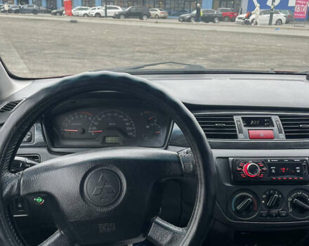 Червоний Міцубісі Lancer, об'ємом двигуна 2 л та пробігом 295 тис. км за 4150 $, фото 9 на Automoto.ua