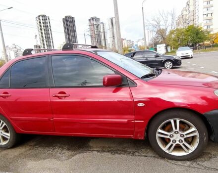 Красный Мицубиси Лансер, объемом двигателя 2 л и пробегом 320 тыс. км за 4600 $, фото 1 на Automoto.ua