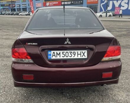 Красный Мицубиси Лансер, объемом двигателя 2 л и пробегом 295 тыс. км за 4150 $, фото 5 на Automoto.ua