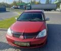 Красный Мицубиси Лансер, объемом двигателя 1.6 л и пробегом 73 тыс. км за 5500 $, фото 1 на Automoto.ua