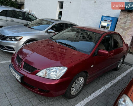 Красный Мицубиси Лансер, объемом двигателя 1.6 л и пробегом 312 тыс. км за 4600 $, фото 1 на Automoto.ua