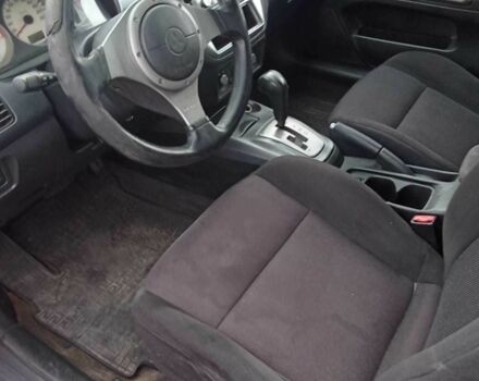 Красный Мицубиси Лансер, объемом двигателя 2 л и пробегом 320 тыс. км за 4600 $, фото 7 на Automoto.ua