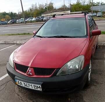 Красный Мицубиси Лансер, объемом двигателя 2 л и пробегом 320 тыс. км за 4600 $, фото 2 на Automoto.ua