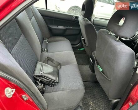 Красный Мицубиси Лансер, объемом двигателя 1.6 л и пробегом 185 тыс. км за 5000 $, фото 9 на Automoto.ua