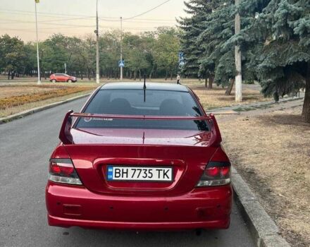 Красный Мицубиси Лансер, объемом двигателя 2 л и пробегом 307 тыс. км за 4500 $, фото 6 на Automoto.ua