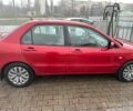 Червоний Міцубісі Lancer, об'ємом двигуна 1.6 л та пробігом 185 тис. км за 5000 $, фото 6 на Automoto.ua