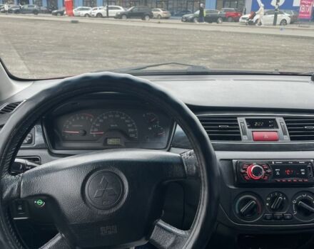 Красный Мицубиси Лансер, объемом двигателя 2 л и пробегом 295 тыс. км за 4150 $, фото 9 на Automoto.ua