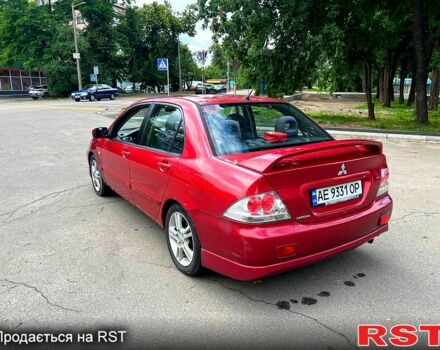 Красный Мицубиси Лансер, объемом двигателя 2 л и пробегом 223 тыс. км за 2900 $, фото 3 на Automoto.ua