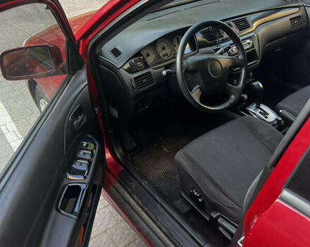 Красный Мицубиси Лансер, объемом двигателя 1.6 л и пробегом 312 тыс. км за 4600 $, фото 7 на Automoto.ua