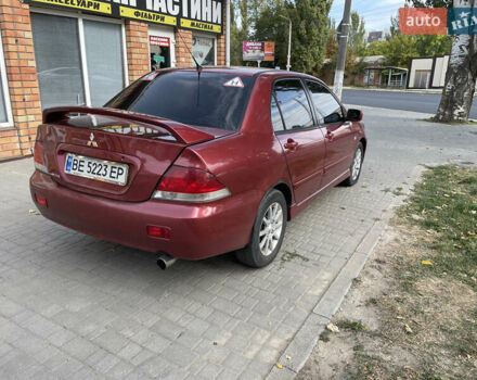 Червоний Міцубісі Lancer, об'ємом двигуна 1.58 л та пробігом 290 тис. км за 4250 $, фото 5 на Automoto.ua