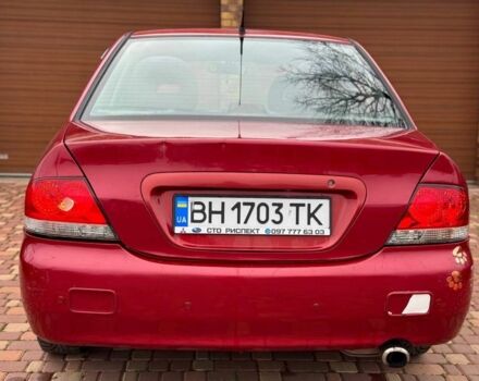 Красный Мицубиси Лансер, объемом двигателя 1.6 л и пробегом 239 тыс. км за 4100 $, фото 4 на Automoto.ua