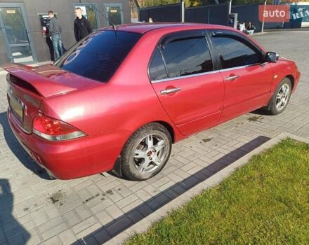 Красный Мицубиси Лансер, объемом двигателя 1.6 л и пробегом 73 тыс. км за 5500 $, фото 4 на Automoto.ua