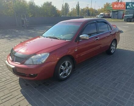 Красный Мицубиси Лансер, объемом двигателя 1.6 л и пробегом 73 тыс. км за 5500 $, фото 1 на Automoto.ua