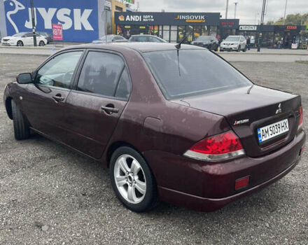 Червоний Міцубісі Lancer, об'ємом двигуна 2 л та пробігом 295 тис. км за 4150 $, фото 6 на Automoto.ua